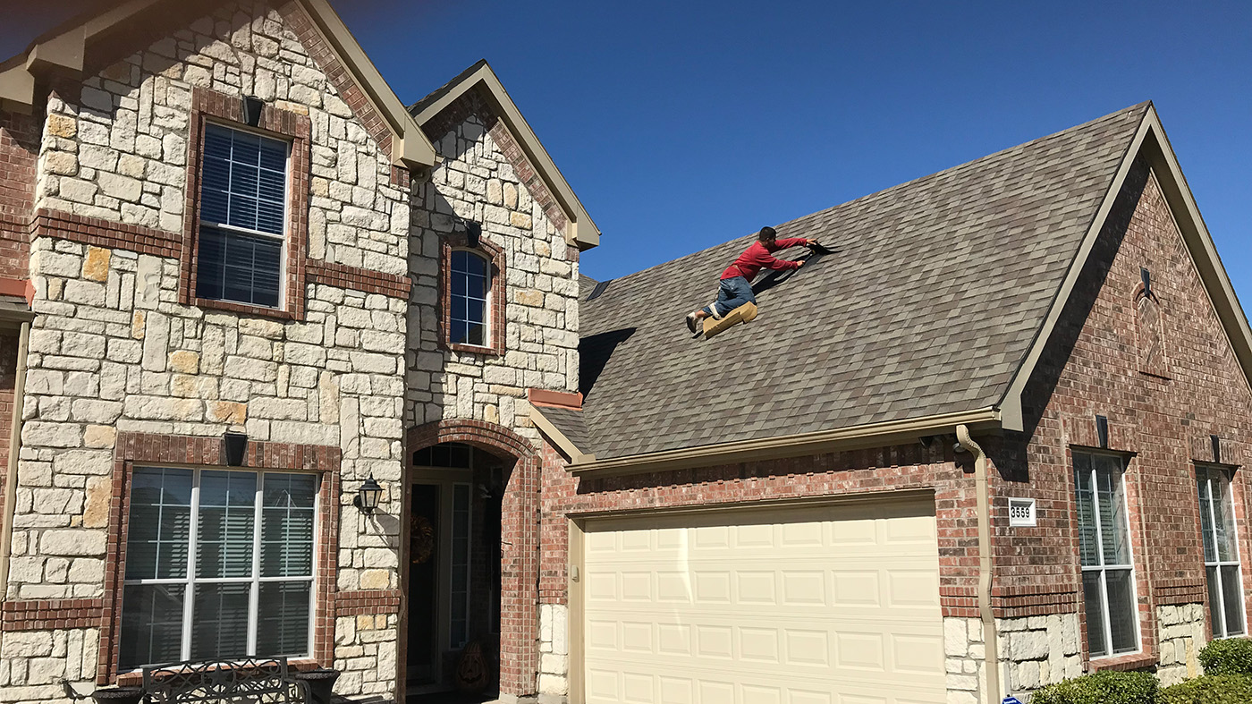 Roof repair work on a residential roof
