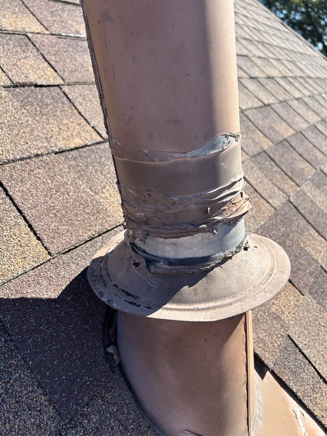 Roof vent pipe with sealed flashing.